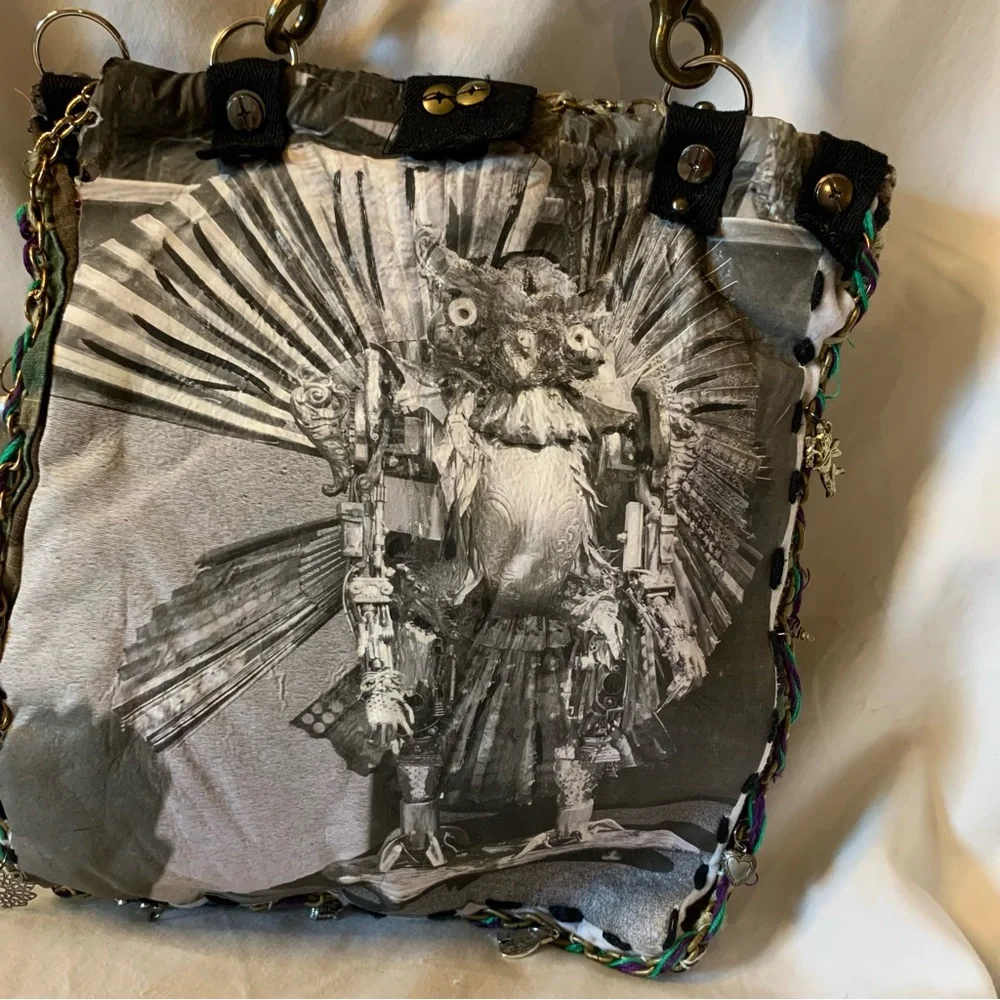 Camouflage Crossbody Bag with Gold Accents and Image of JK Punkmetal Sculpture. - Picture 7 of 7